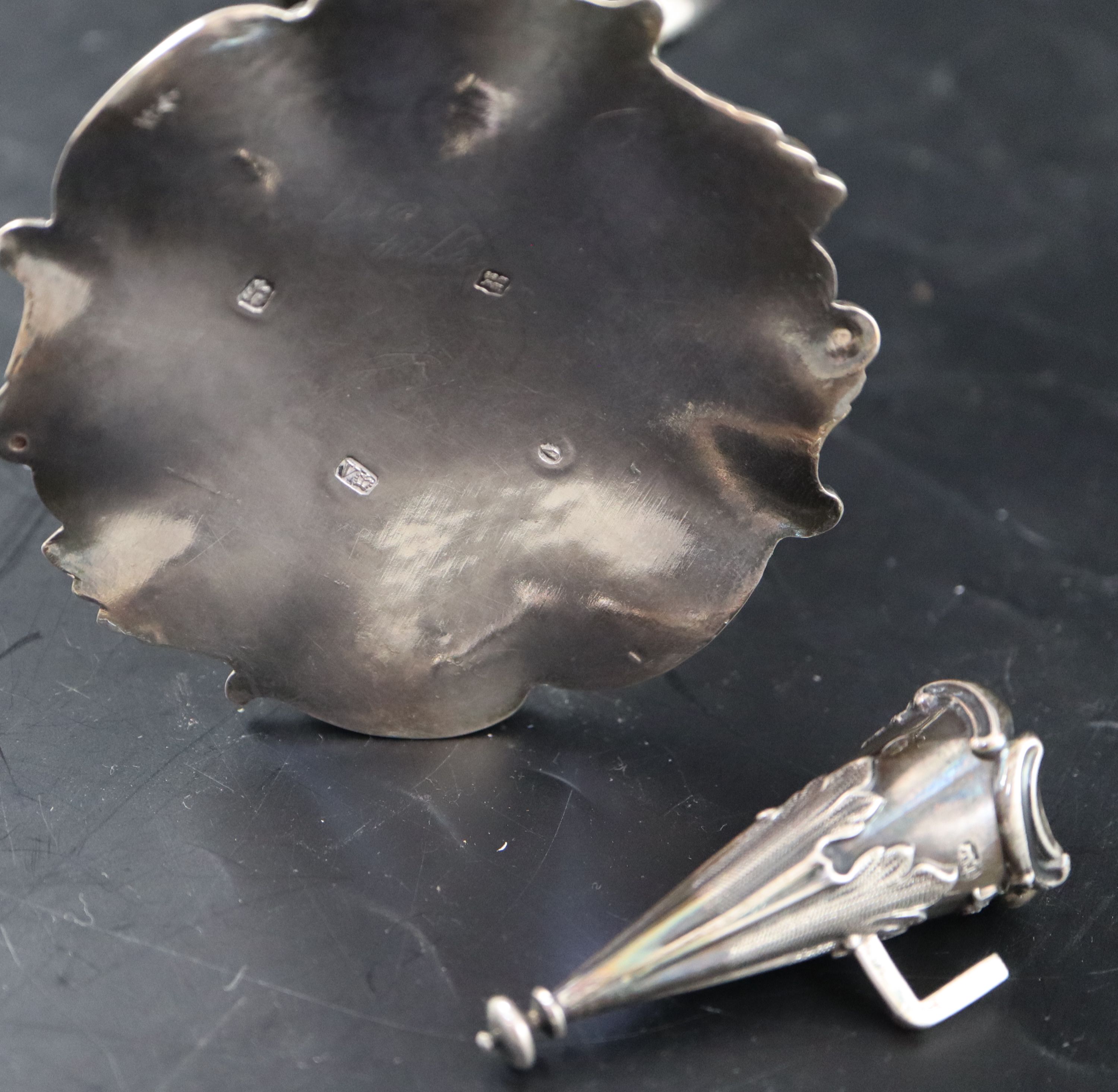 An ornate Victorian silver chamberstick, 14.3cm, gross 194 grams.